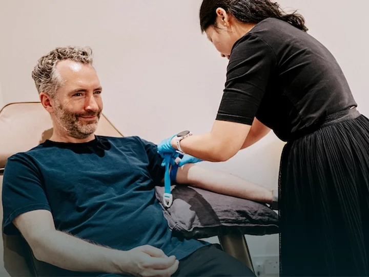 A patient having a blood sample taken at a clinic