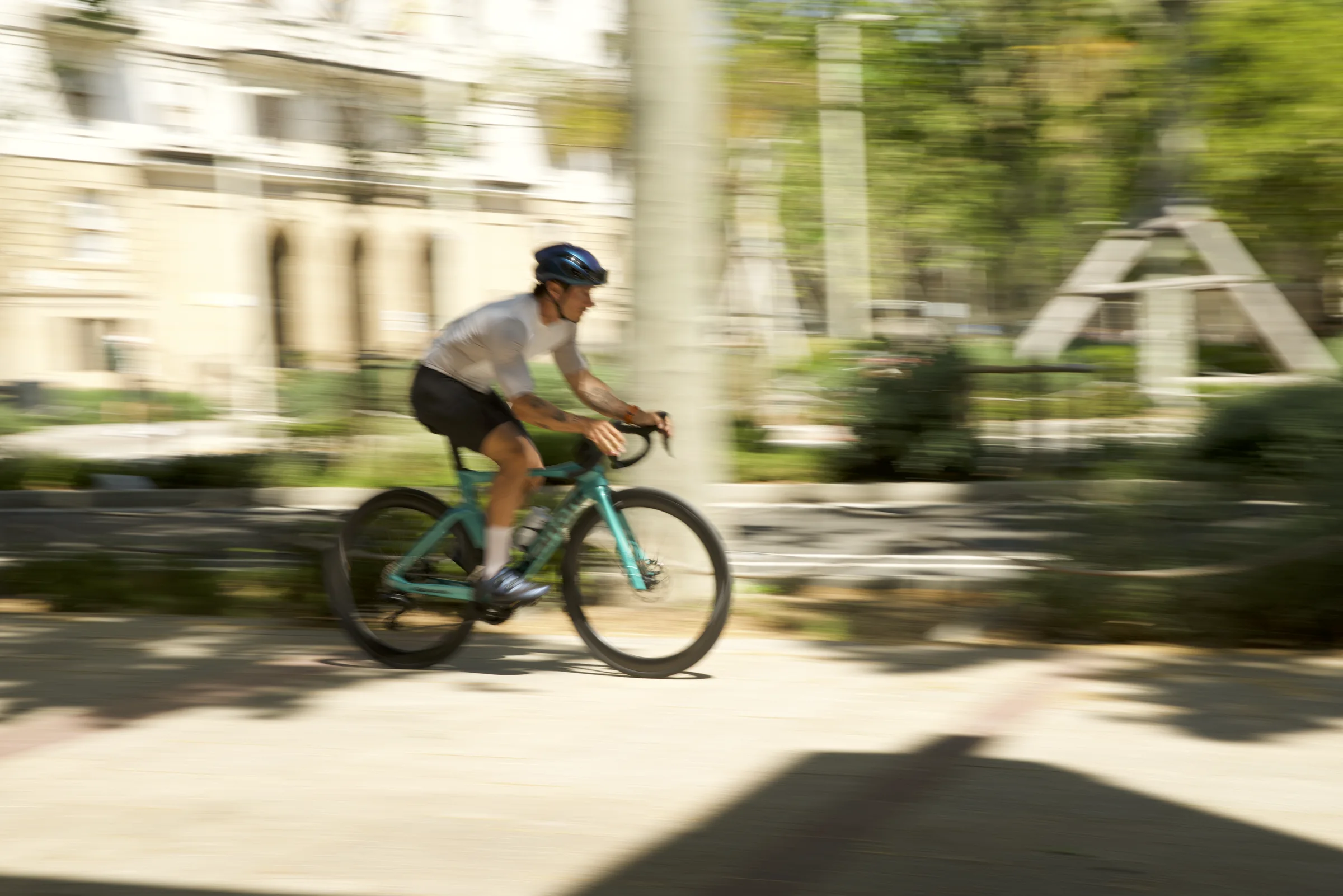 A cyclist riding at speed